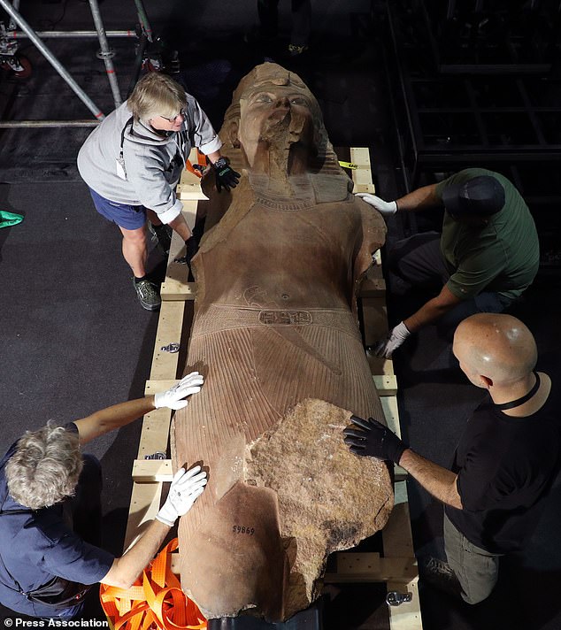 19189264-7527979-Technicians_at_the_Grande_Halle_de_la_Villette_in_Paris_pack_the-a-4_1570000501436