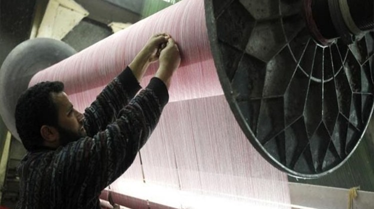 A laborer works at a textile mill in Mahalla el-Kubra, about 110 km north of Cairo - Reuters/Mohamed Abd El Ghany
